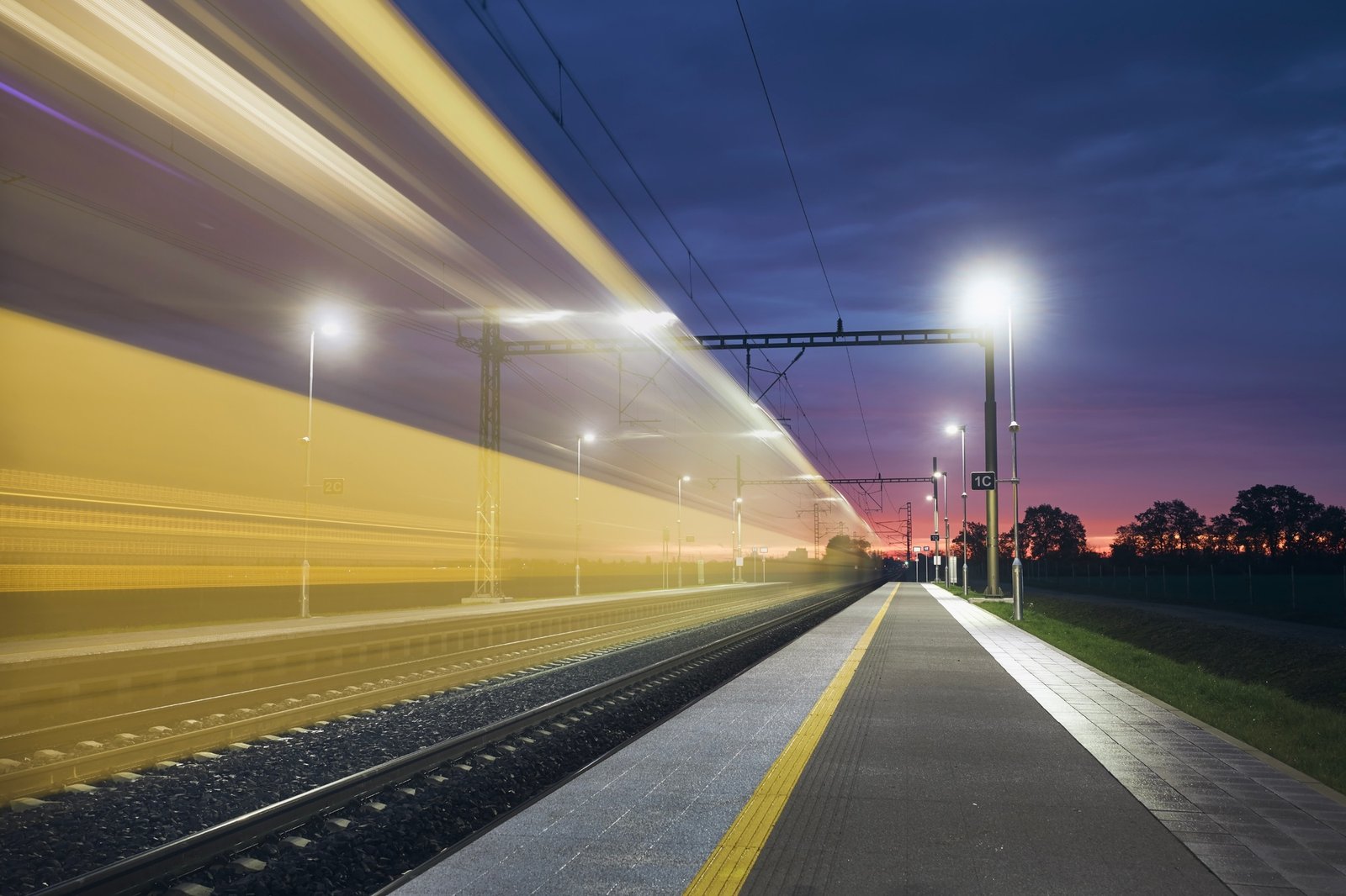 Light trail of high speed train on railroad track